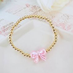 Gorgeous 14k Gold Plated 4mm Beaded Bracelet With A Pink Pearl Bow Bead Perfect Bracelet To Wear Alone Or Stacked With Other Favorite Pieces Bracelet Measures Approximately 7 Inches This Is For One Bracelet Only Tags: Preppy, Coquette, Pearls, Pink Bow, Spring Fashion, Gift For Her, Easter, Trend, Trendy, Love Shack Fancy, Stoney Clover Lane, Enewton, Mean Girls,, Bridgerton Preppy Gold Bracelet Stack, Couqutte Jewelry, Summer Jewelry Stack, Love Shack Fancy Jewelry, Love Shack Fancy Bracelet, Preppy Brackets, Cute Party Favors For Teens, Preppy Stuff To Get For Your Birthday, Fancy Beaded Bracelets