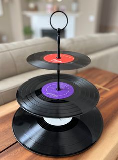 three black records stacked on top of each other