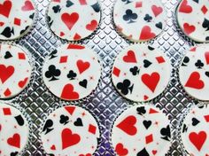 cupcakes decorated with playing cards and hearts