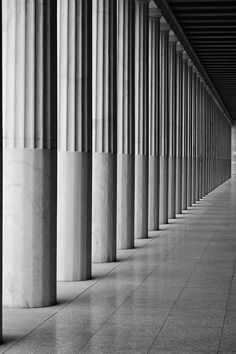 black and white photograph of columns in an empty building