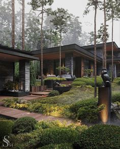 an artistic rendering of a house in the middle of some trees and bushes with a fountain