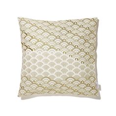 a gold and white pillow on a white background