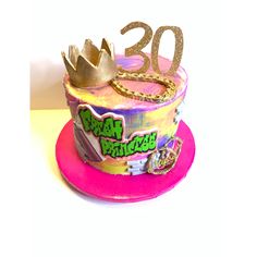 a birthday cake with the number twenty on it and a crown on top is shown