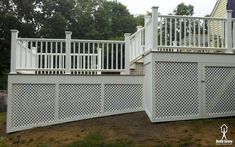 a white deck with trellis on the sides