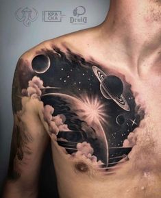 a man's chest with planets and stars on it, as well as clouds