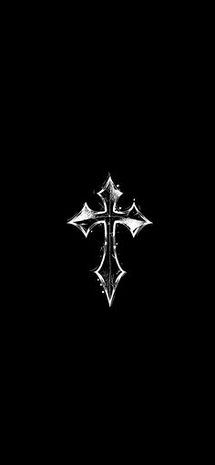 a black and white photo of a cross on a dark background with the word faith written below it