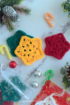 crocheted christmas decorations on a marble surface