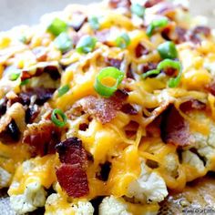 a close up of a plate of food with broccoli and bacon on it