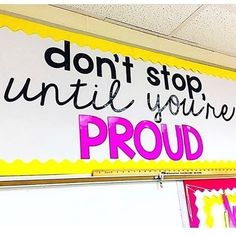 a sign that says don't stop until you're proud on the wall