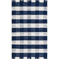 a blue and white checkered rug with fringes