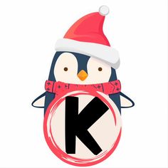 a penguin wearing a santa hat and scarf holding a letter k in front of it's face