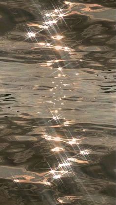 the sun shines brightly in the water as it reflects on the surface and creates an interesting pattern