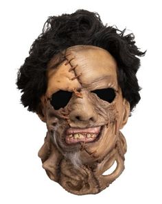 an adult mask with hair and makeup on it