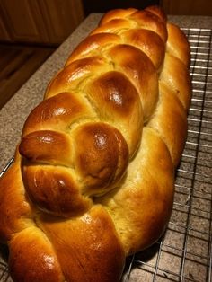 a loaf of bread sitting on top of a cooling rack