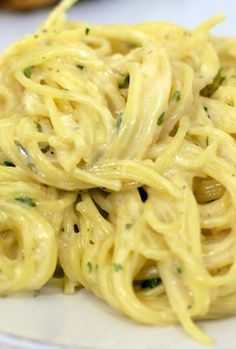 a plate of pasta with broccoli on it