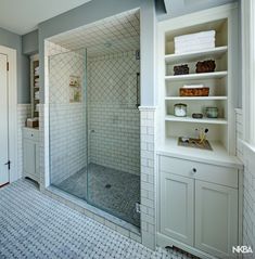 a walk in shower sitting inside of a bathroom