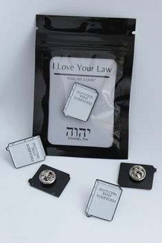 three pins in a pouch with the words i love your law written on them