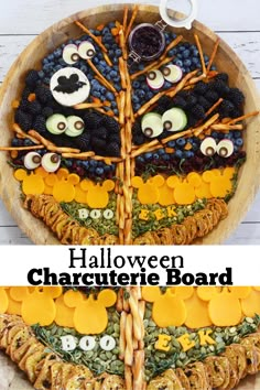 this halloween charure board is made with grapes, blackberries, oranges and jack - o'- lantern eyes