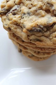 a stack of cookies sitting on top of a white plate