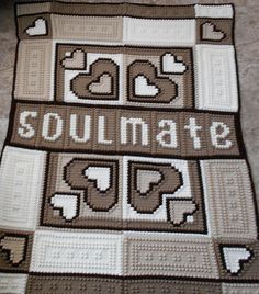 a crocheted blanket with the words soulmate on it