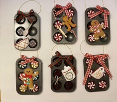 christmas ornaments are hanging on the wall in different shapes and sizes, including gingerbreads