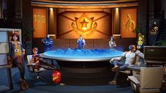 a group of people sitting around a table in front of a tv screen with an orange star on it