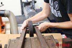 a man working on a piece of wood