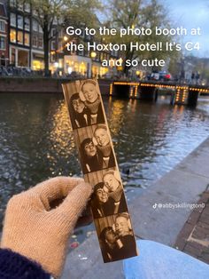 a person holding up a photo in front of the water with other people on it