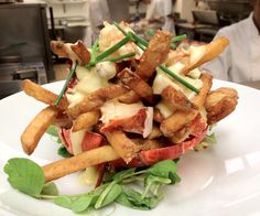 a white plate topped with nachos and chips