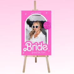 a pink photo frame with the words bride printed on it and a woman's face in sunglasses