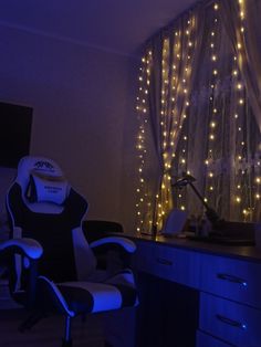 an office chair sitting in front of a desk with lights on it