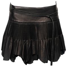 ▪ Archival Jean Paul Gaultier Leather Mini Skirt ▪ Fall-Winter 2003 ▪ Constructed from black leather ▪ Cartridge pleats ▪ Raw-edge hem ▪ Self-tie wrap fastening ▪ IT42 - FR38 - UK10 ▪ Made in Italy The photographs presented in this listing, with the exception of any reference or runway imagery, require proper credit to be attributed to the copyright owner, in order to perform specific actions such as copying the images or sharing them online. It is strictly prohibited to utilise the images for s Cartridge Pleats, Jean Paul Gaultier Women, Festival Attire, Mini Wrap Skirt, White Pleated Skirt, Mini Wrap, Tie Wrap, Leather Mini Skirt, Black Leather Skirts