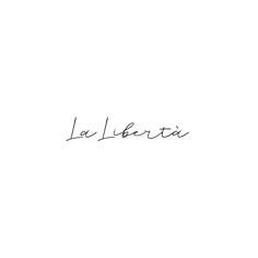 the word la liberta written in cursive ink on a white background