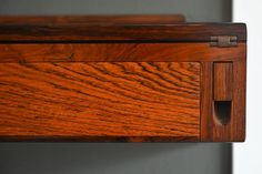 a close up view of a wooden drawer