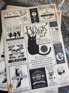 the black cat newspaper is laying on top of some other papers and has been altered to look like an old book