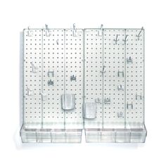 two clear pegboard displays with cups and spoons