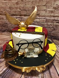 a cake with glasses and a hat on it