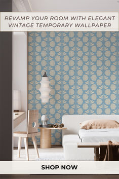 a bedroom with blue and white wallpaper in the background is an image of a bed