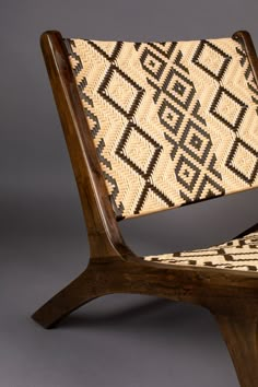 a chair made out of wood and woven material