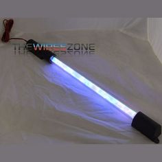 a white sheet with a blue light on it and a cord attached to the end