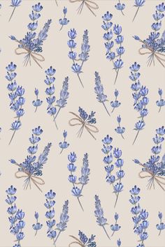 blue flowers are arranged on a beige background