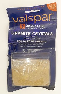 a package of granite crystals on a white surface