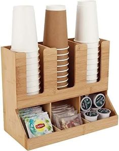 a wooden holder with cups and plates in it