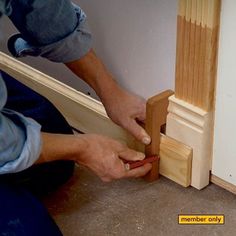 a person is working on a door frame