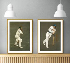 two framed pictures of men playing cricket, one is holding a bat and the other has a ball