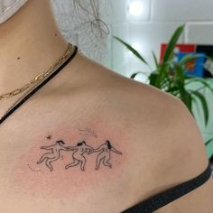 a woman with a tattoo on her shoulder