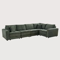 a large sectional couch with pillows on it