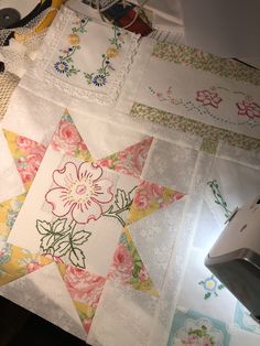 the quilts are laid out on the table to be sewn and stitched