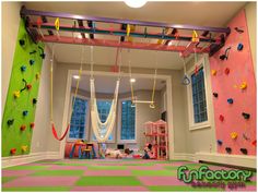 a child's room with climbing walls and toys