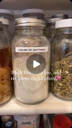 jars filled with food sitting on top of a shelf